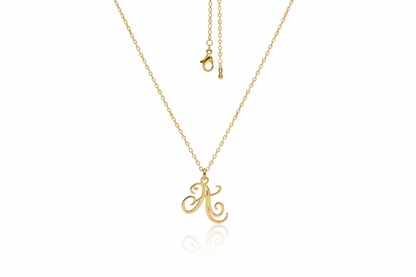 Gold necklace with a letter 'A' pendant on a white background