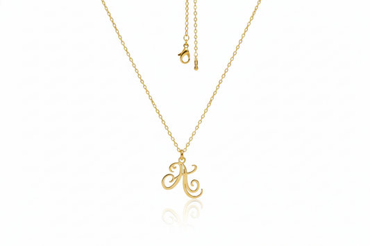 Gold necklace with a letter 'A' pendant on a white background