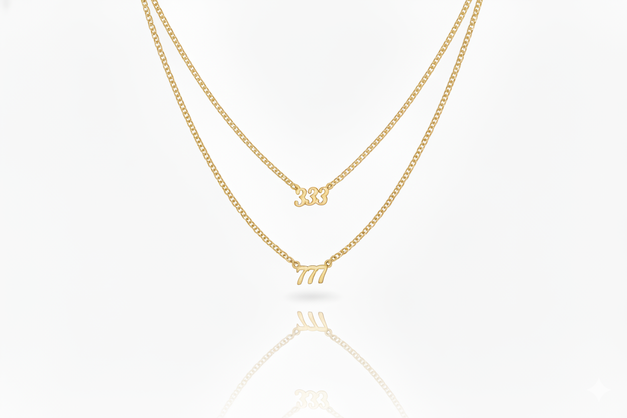 Three gold necklaces with different designs on a white background