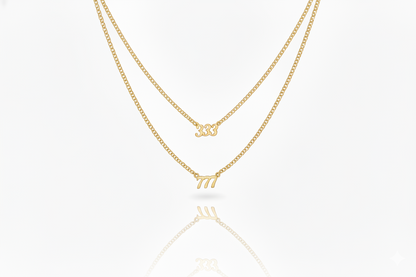 Three gold necklaces with different designs on a white background
