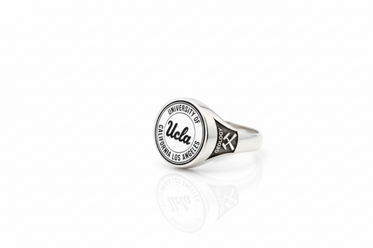 Silver ring with UCLA logo on a white background