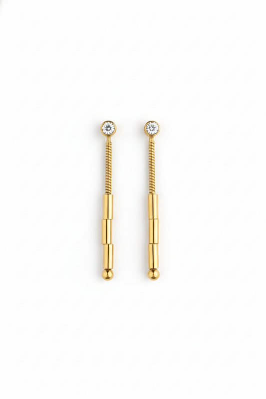 Gold spiral earrings on a white background