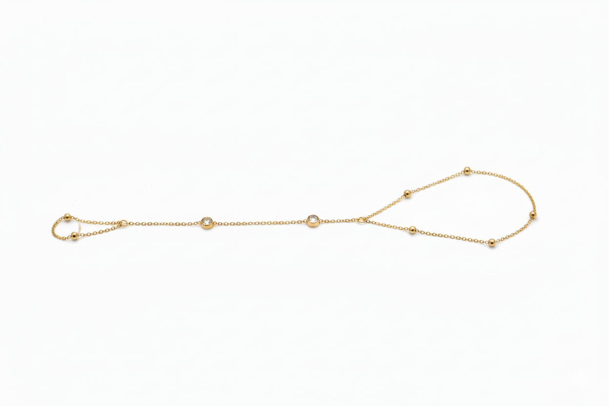Gold bracelet with small beads on a white background