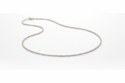 Silver chain necklace on a white background