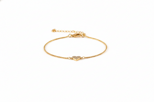Gold bracelet with a clasp on a white background