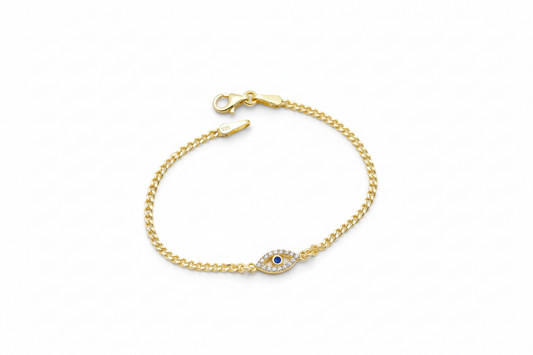 Gold bracelet with a blue gemstone on a white background