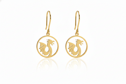 Gold earrings with dragon design on a white background