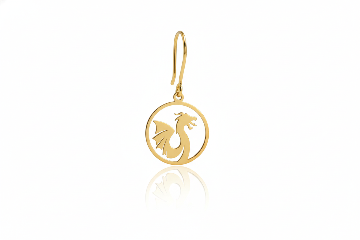 Gold earring with a dragon design on a white background