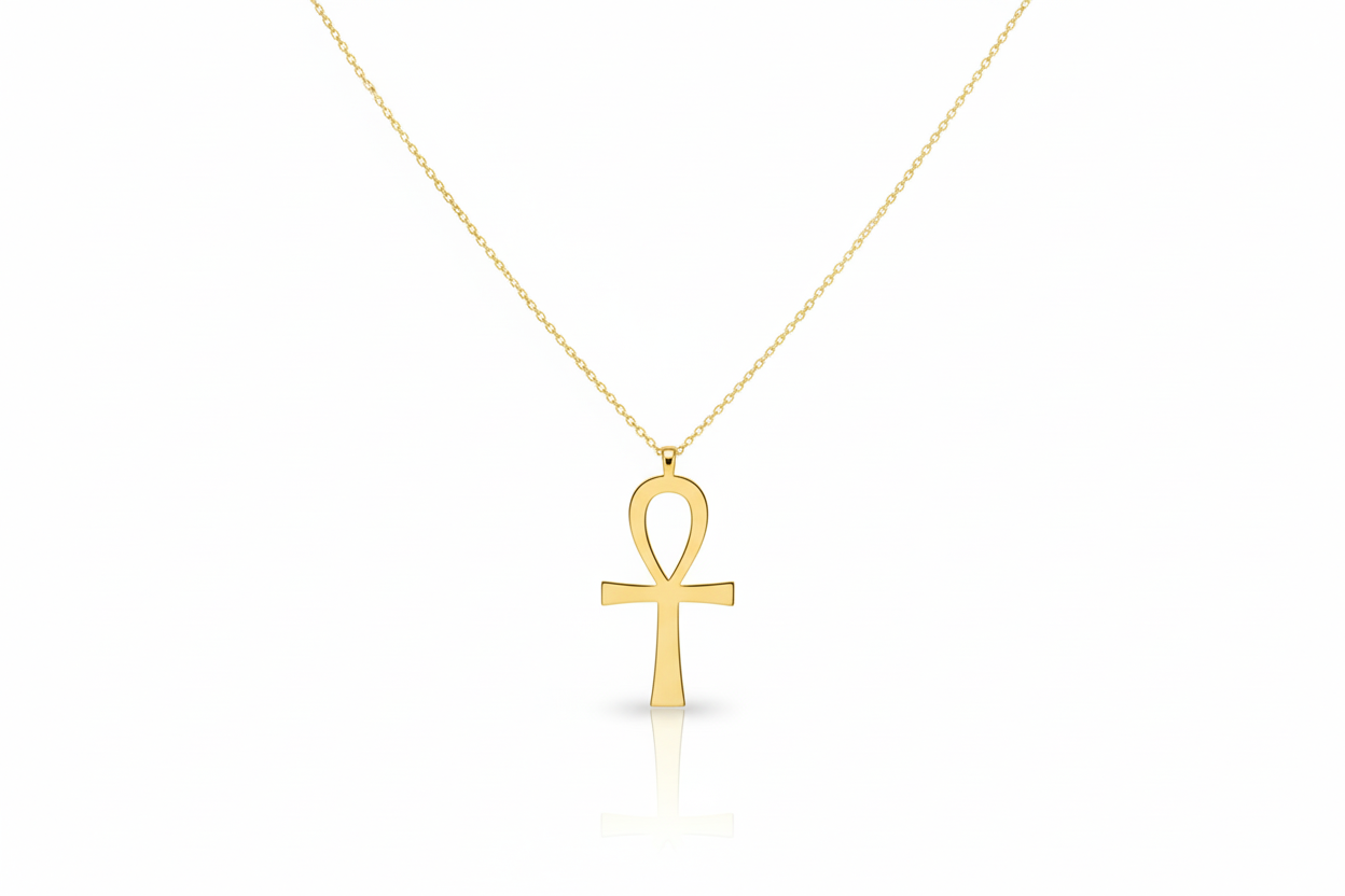 Gold Ankh pendant necklace on a white background