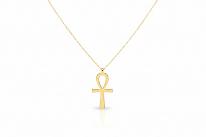 Gold Ankh pendant necklace on a white background
