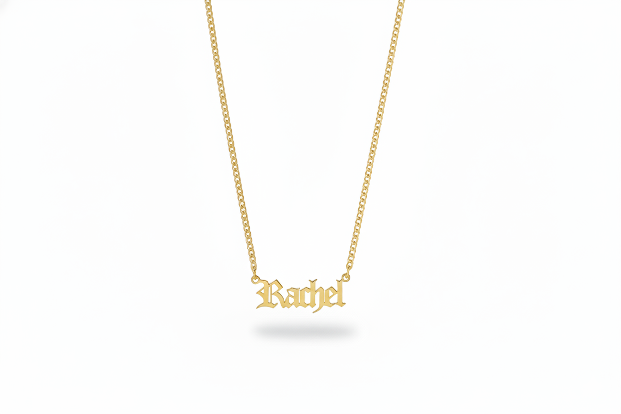 Gold necklace with 'Rachel' pendant with a dainty urb chain on a white background