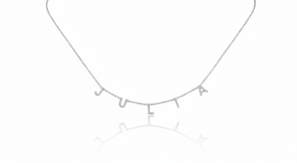 Silver necklace with letter 'E' pendant on a white background