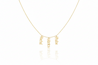 Gold necklace with engraved names on a white background