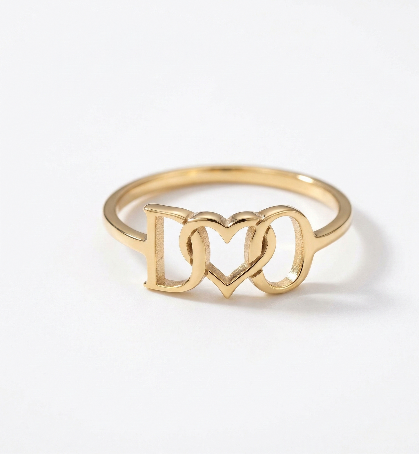 Gold ring with 'I ❤️ ❤️' design on a white background