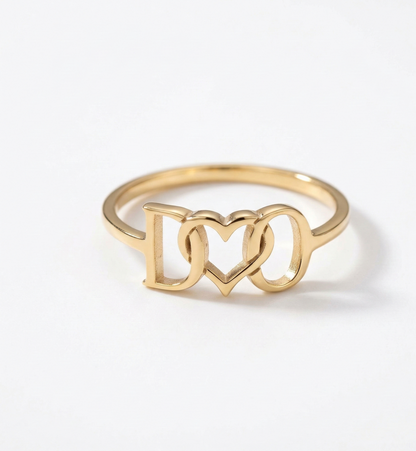 Gold ring with 'I ❤️ ❤️' design on a white background