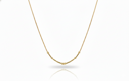 Gold necklace on a white background