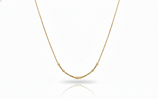 Gold necklace on a white background