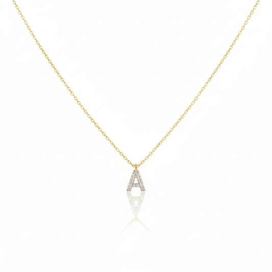 Gold necklace with a diamond pendant on a white background