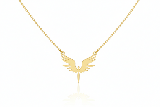 Gold necklace with an angel wing pendant on a white background