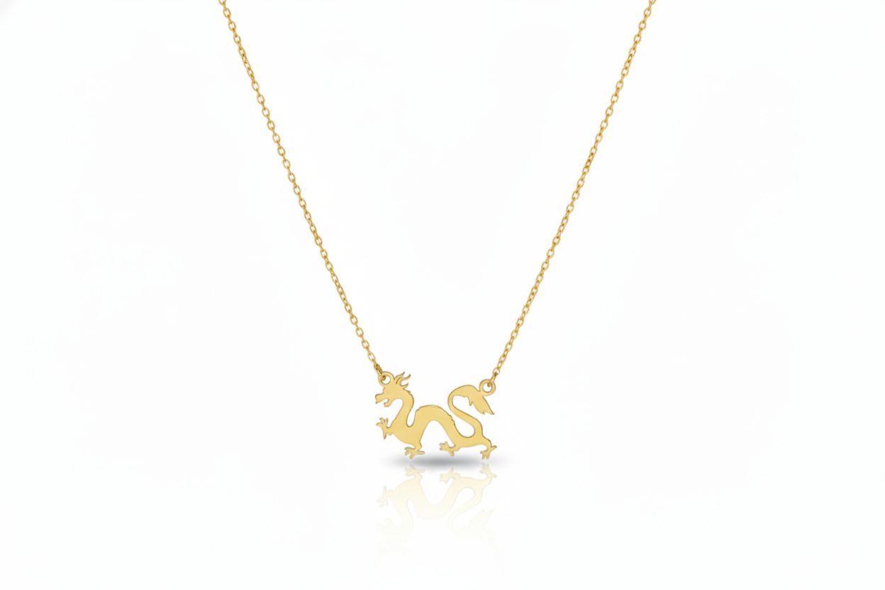 Gold dragon necklace on a white background