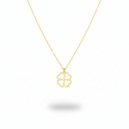 Gold necklace with a clover-shaped pendant on a white background