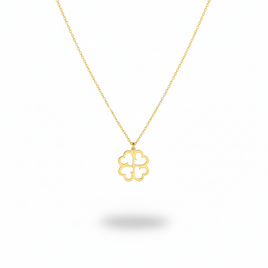 Gold necklace with a clover-shaped pendant on a white background