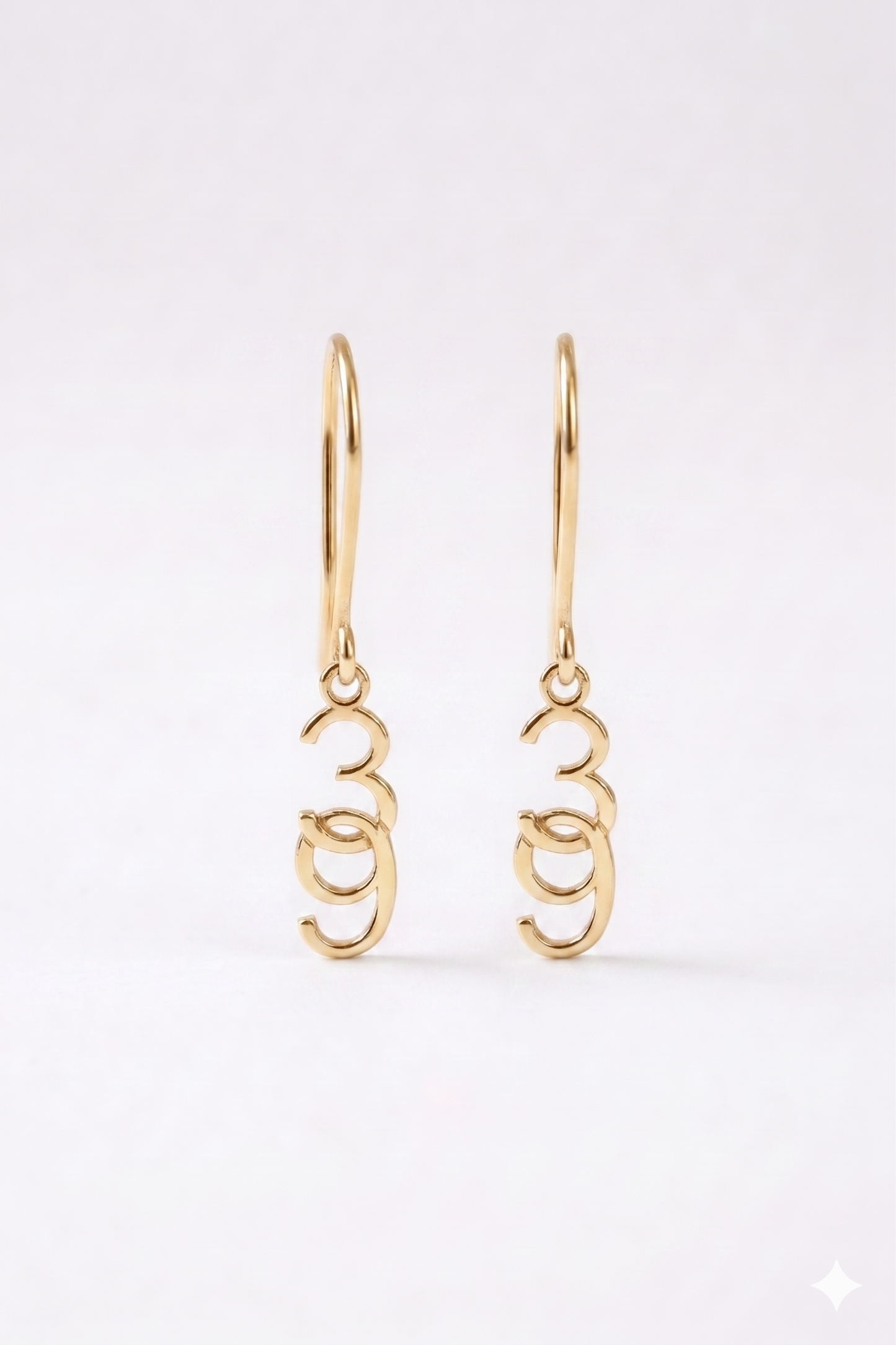 Gold hoop earrings on a white background