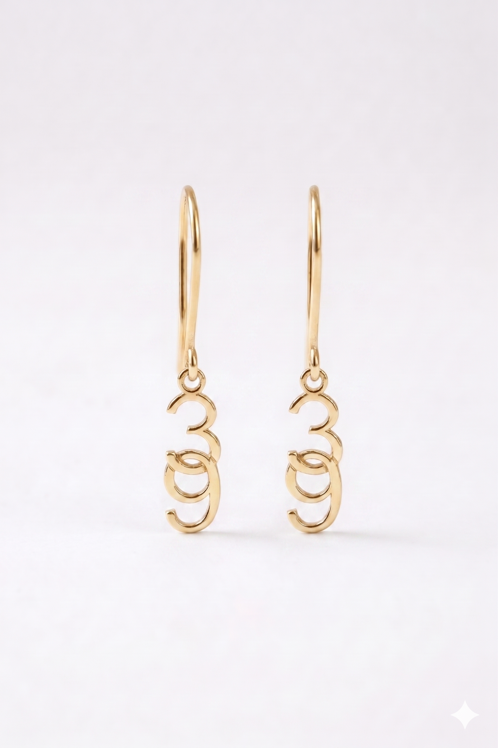 Gold hoop earrings on a white background