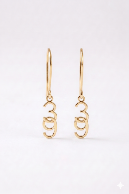 Gold hoop earrings on a white background