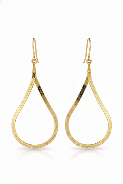 Gold hoop earrings on a white background