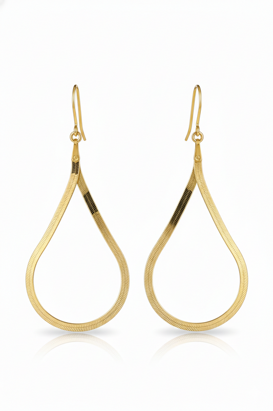 Gold hoop earrings on a white background