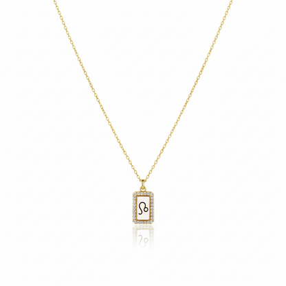 Gold necklace with a zodiac sign pendant on a white background