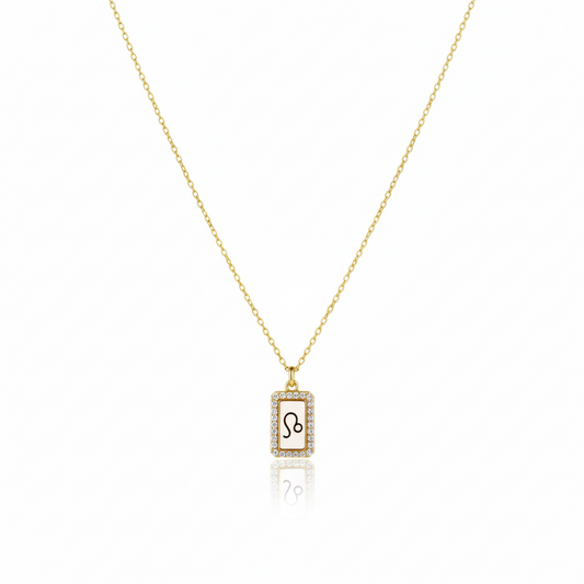 Gold necklace with a zodiac sign pendant on a white background