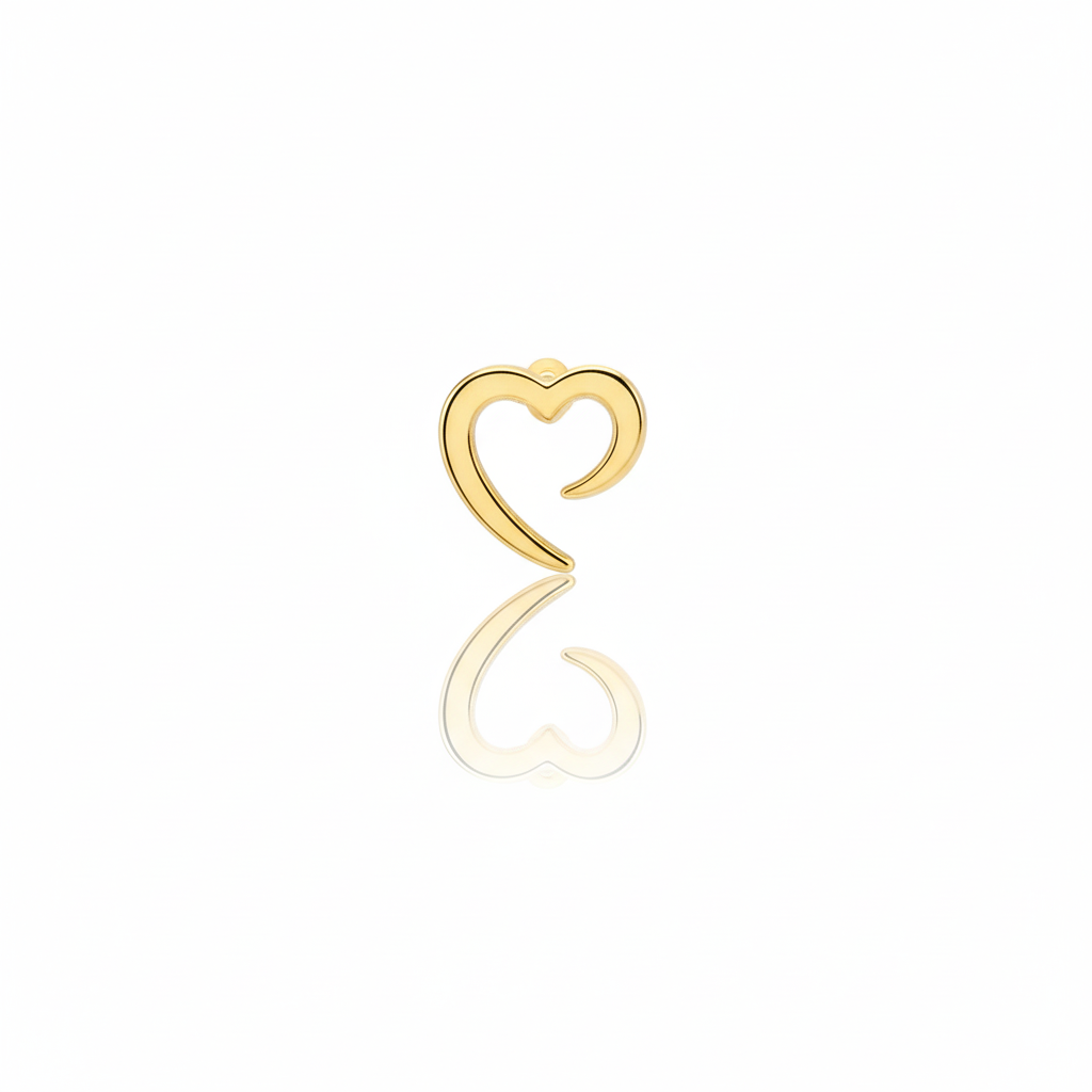 Gold heart-shaped earring on a white background