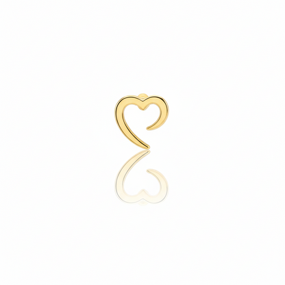 Gold heart-shaped earring on a white background