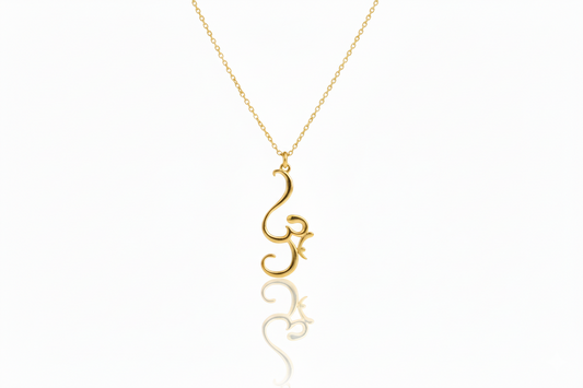 Gold necklace with a unique pendant on a white background