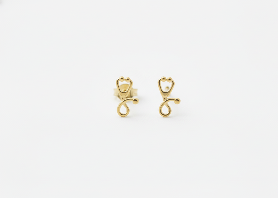 Pair of gold earrings on a white background