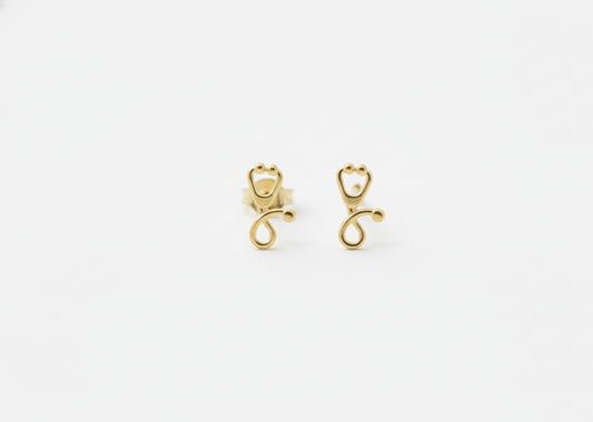 Pair of gold earrings on a white background