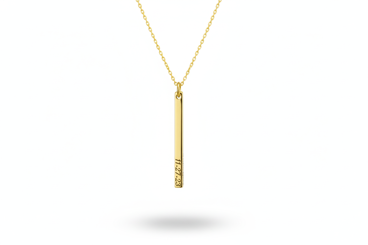 Gold necklace with a vertical pendant on a white background