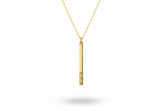 Gold necklace with a vertical pendant on a white background