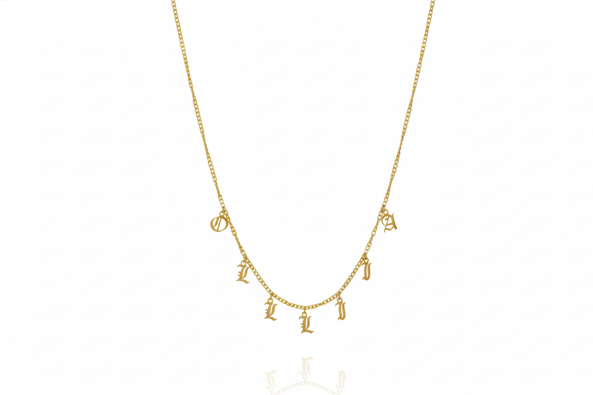 Personalized name necklace with Gothic dangle letters on a gold curb chain, showcasing unique style and elegance.