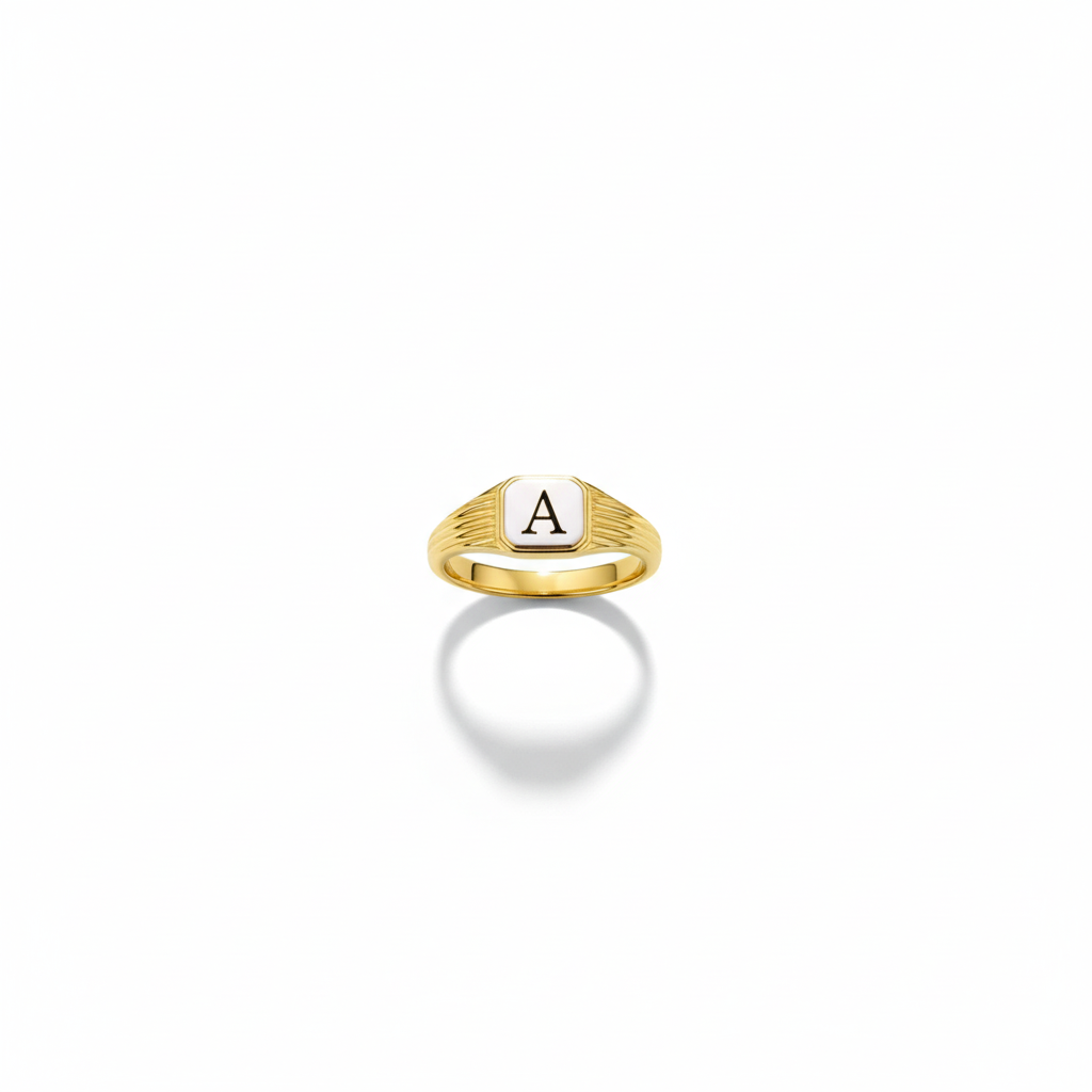 Gold ring with a letter 'A' on a white background