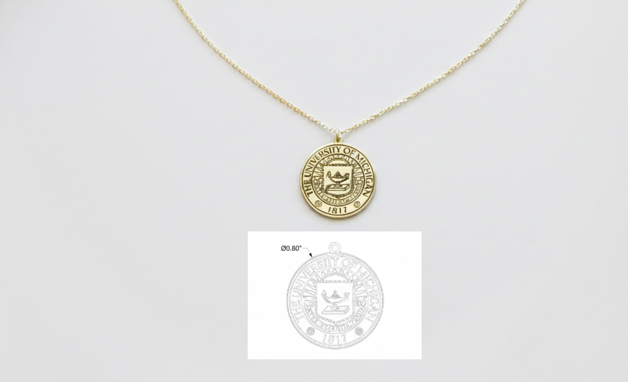 Gold necklace with a round pendant on a light gray background