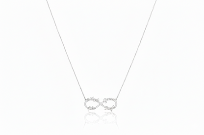 Silver infinity necklace on a white background