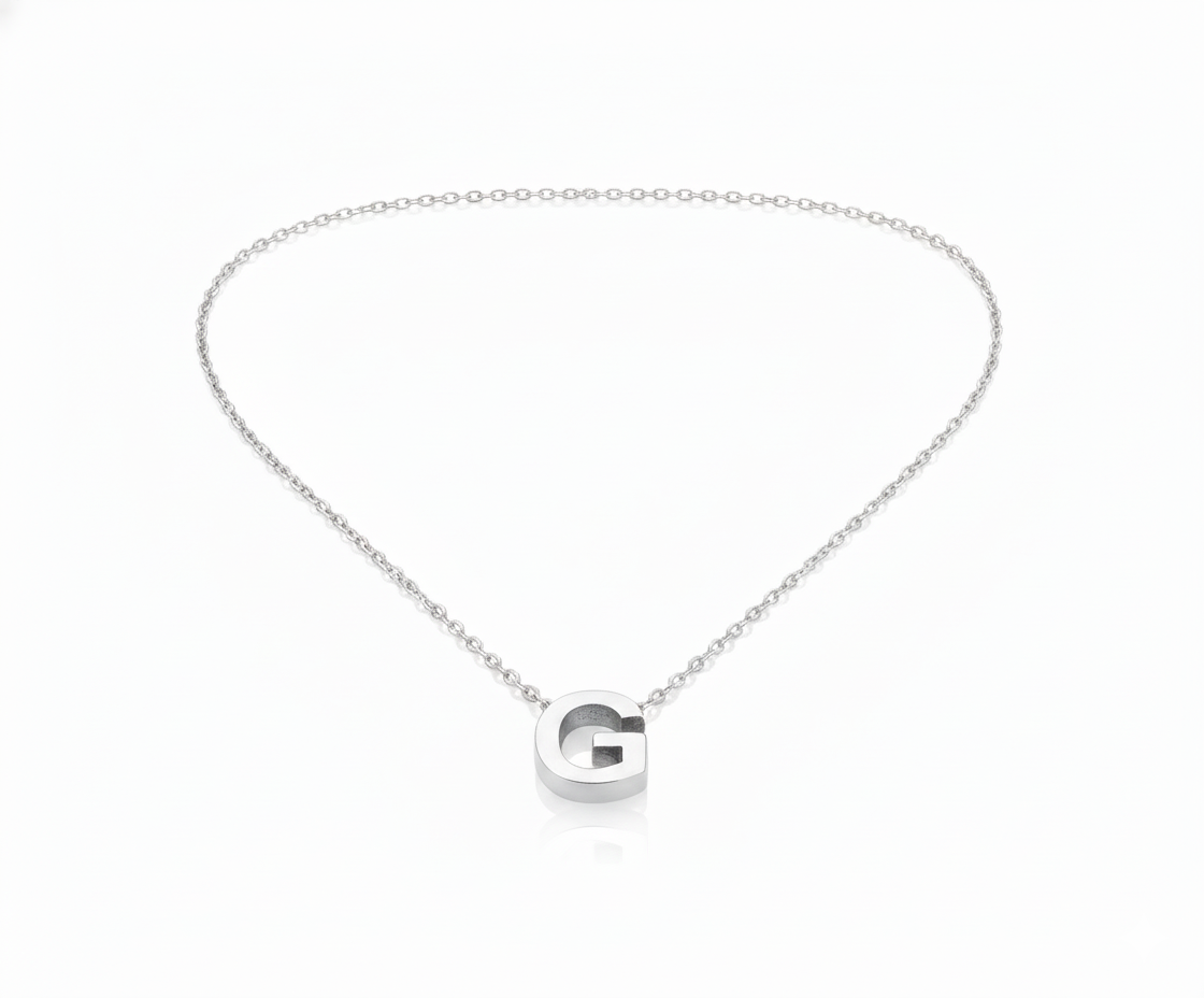 Silver necklace with a 'G' pendant on a white background