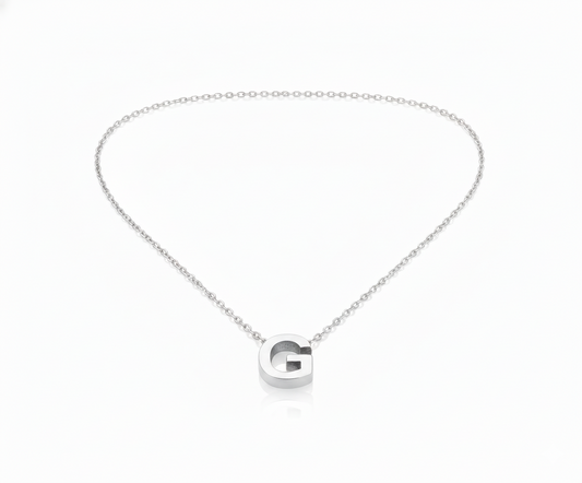 Silver necklace with a 'G' pendant on a white background