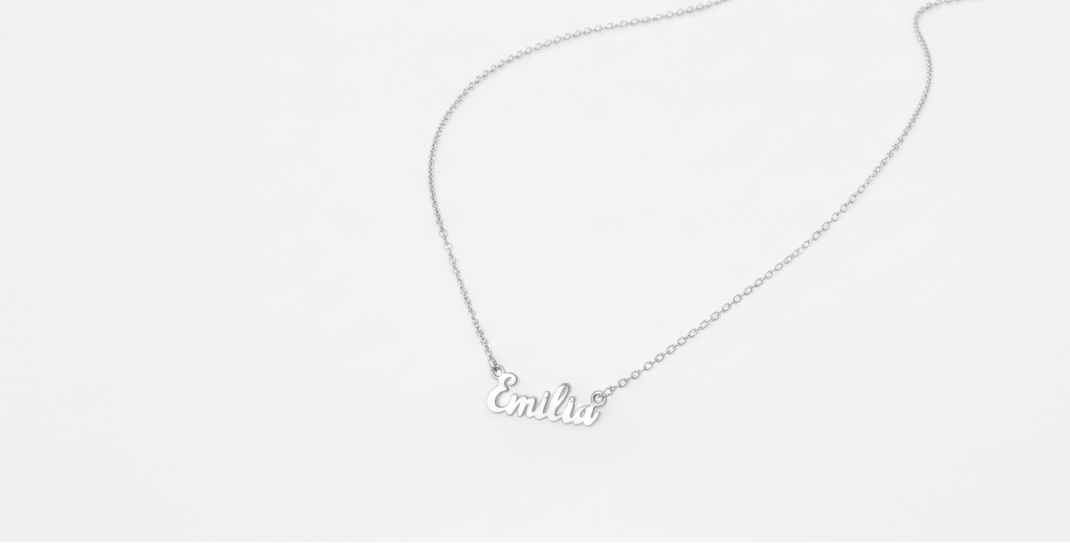 Silver necklace with 'Evelyn' pendant on a white background