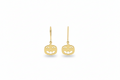 Gold pumpkin-shaped earrings on a white background