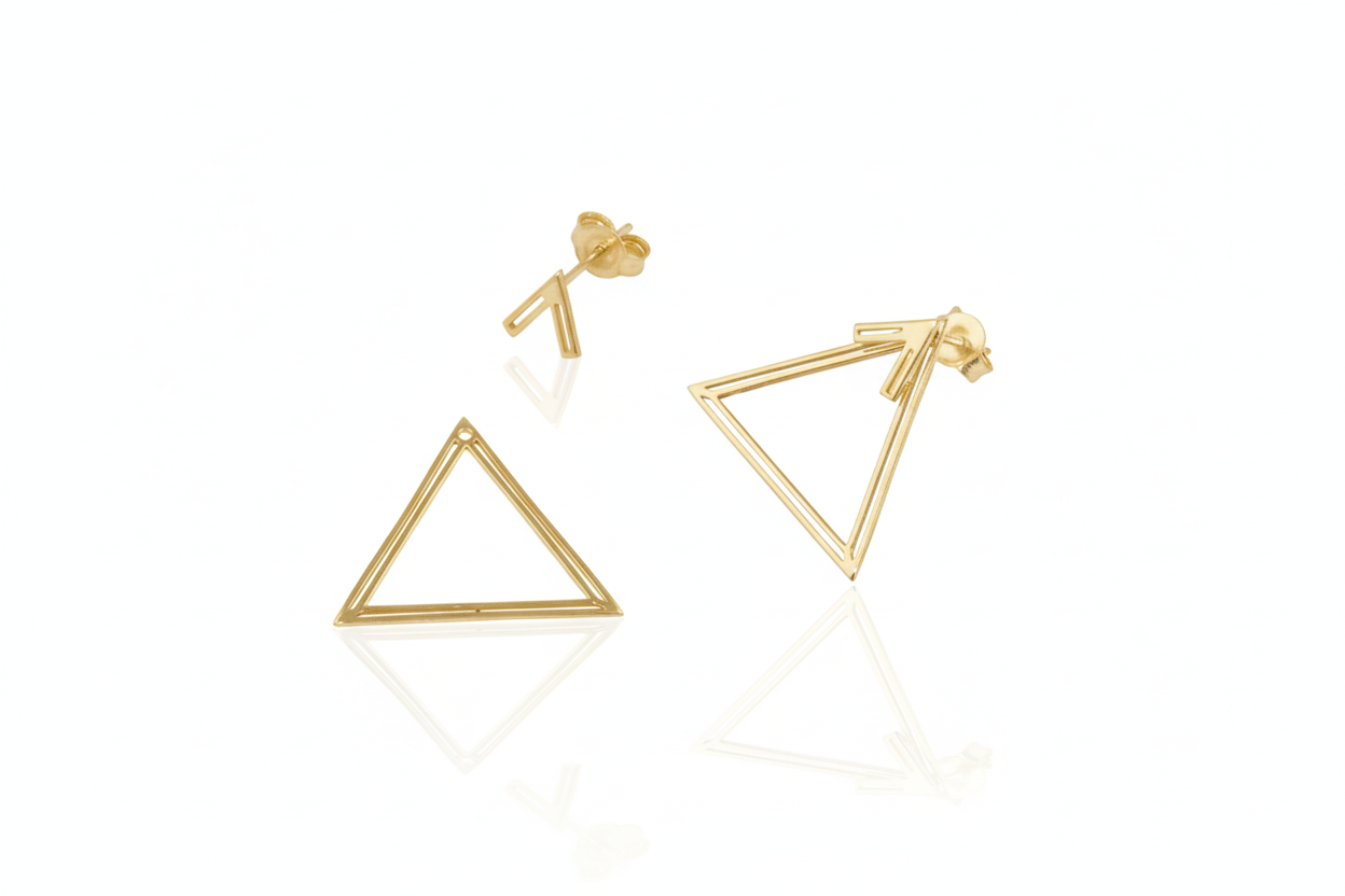 Gold triangle ear jacket earrings on a white background