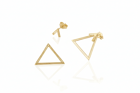 Gold triangle ear jacket earrings on a white background